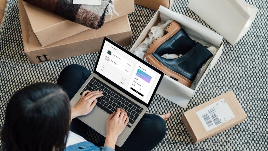 Smart shopper using discount coupons and budget tips while shopping online in New Jersey