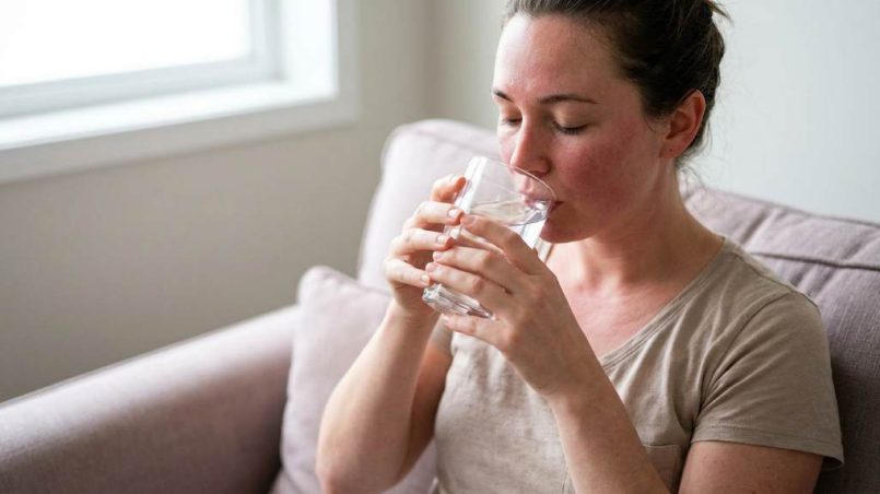 Person relaxing after massage while recovering from muscle soreness